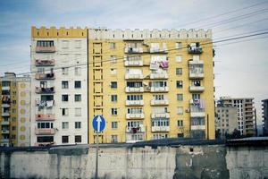 Ugly yellow residential building built in Soviet era. photo