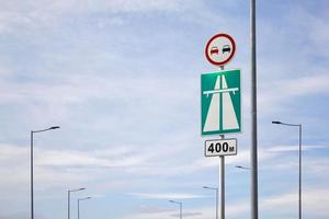 Traffic sign view against the blue sky. photo