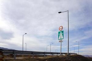 Traffic sign view against the blue sky. photo