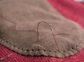 patch sewing with selective focus on needle photo