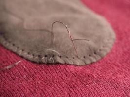 patch sewing with selective focus on needle photo