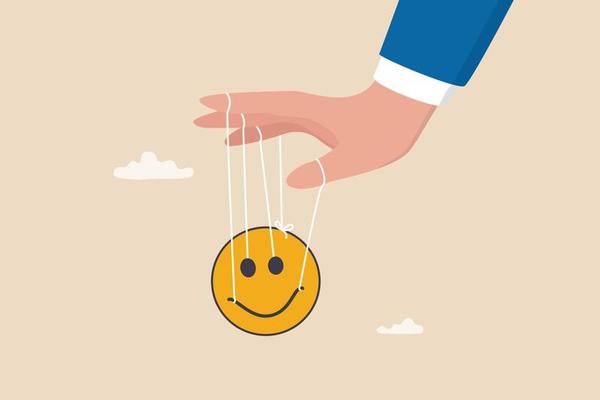 Control emotion or expression, emotional intelligence manage positive way to solve problem and conflict concept, businessman hand tied with string to control, manipulate smile face like puppet doll.
