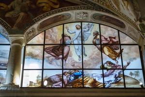 Leggiuno, Varese, Italy, 2022 - Stained glass windows of the church of Santa Caterina del Sasso. It is a monastery built in 1170, overlooking the eastern shore of Lake Maggiore, Northern Italy. photo