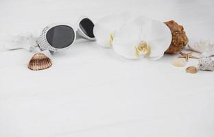 Shells, orchids and sunglasses photo