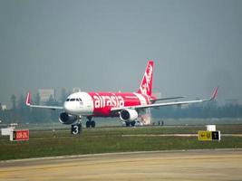 Don Muang BANGKOK THAILAND12 JANUARY 2019The aircraft of AirAsia Airlines is takeoff from Don Mueang Airport.on Don Muang BANGKOK THAILAND12 JANUARY 2019. photo