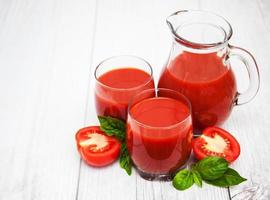 Glasses with tomato juice photo