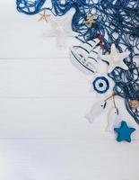 Fishing net with starfish and sea decorations photo