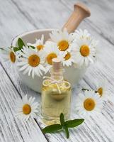 Massage oil and chamomile photo