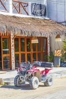 Holbox Mexico 21. December 2021 Quad bike buggy golf cart muddy street village Holbox Mexico. photo