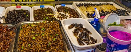 Thai food sale eating insects Khaosan Khao San Road Bangkok. photo