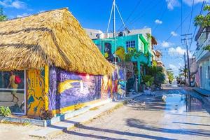 Holbox Mexico 22. December 2021 Colorful Holbox island village with stores mud and people Mexico. photo