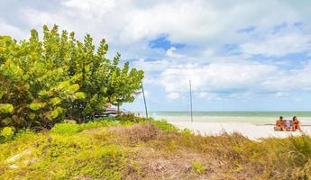 Holbox Mexico 22. December 2021 Beautiful Holbox island beach sandbank panorama palapa sun loungers Mexico. photo