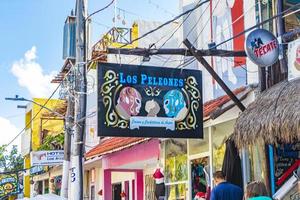 Holbox Mexico 22. December 2021 Colorful Holbox island village with stores mud and people Mexico. photo