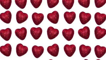 stop motion video of running red hearts on a white background