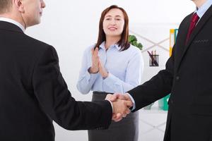 Successful business partnership concept with businessmans handshake. Happy businesswoman applause at office background. Team work businessmen handshaking after profitable deal. Selective focus. Banner photo