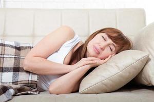 Daytime sleep. Middle age woman sleeping on bed in modern apartment. Home background. Copy space and mock up. Menopause photo