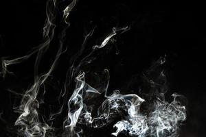 Smoke effect texture. Isolated background. Black and dark backdrop. Smokey fire and mistic effect. photo