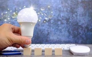 Notion of an illuminated light bulb, idea, invention, and inspiration photo