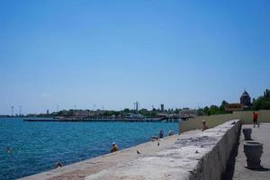 Evpatoria, Crimea - may 24, 2018 -Seascape with people on the city's waterfront. photo