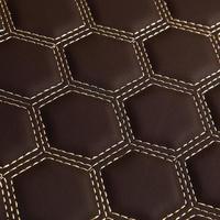 Texture of brown leather background with square pattern and stitch, macro photo