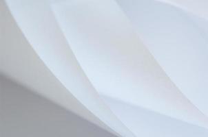 abstract background of a twisted sheet of white paper photo