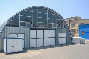 facade of an industrial warehouse with an oval roof photo