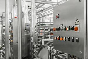 electronic control panel and tank at a milk factory. equipment at the dairy plant photo