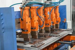 Industrial welding machines in the workshop, in the process of work and movement photo