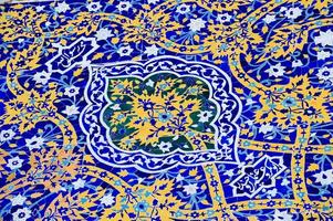 asian old ceramic mosaic. elements of oriental ornament on ceramic tiles photo