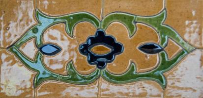 asian old ceramic mosaic. elements of oriental ornament on ceramic tiles photo