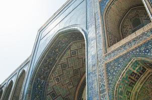 Arch and architecture of the ancient Registan in Samarkand. Ancient architecture of Central Asia photo