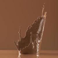The brown liquid splash in brown scene, abstract background for product presentation. 3d rendering photo