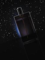 abstract transparent square bottles on a black background with stars, product for present. photo