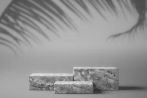 three white marbles are graduated in a white scene with tree shadow on top, abstract mockup background for product presentation. photo