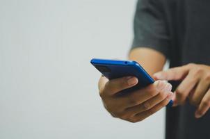 man using mobile phone social media and modern technology or online shopping for financial transactions.Copy space photo