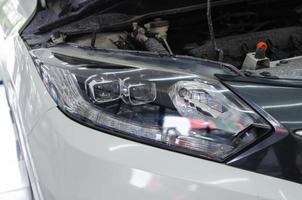 Car headlights after polishing to shine. car details photo