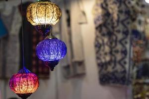 Oriental colorful glass hanging lamps or lanterns artistic selective focus background. photo