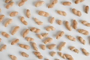 Peanuts in shell on a white background photo