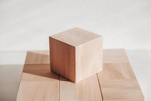 Wooden cubes from natural wood on a white background. Copy, empty space for text photo