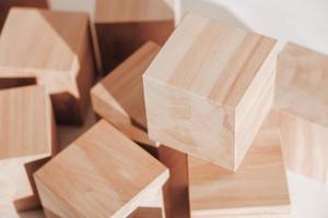 Wooden cubes from natural wood on a white background. Copy, empty space for text photo
