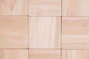 Texture of wooden cubes from natural wood as a background. Copy, empty space for text photo