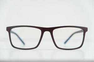 Optical glasses in a dark frame on a white background. Copy, empty space for text photo