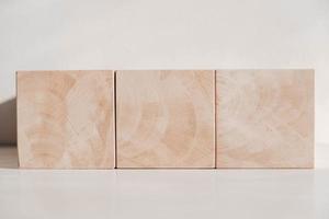 Wooden cubes from natural wood on a white background. Copy, empty space for text photo