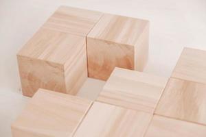 Stack wooden blocks from natural wood on a white background. Copy, empty space for text photo