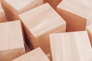 Wooden cubes from natural wood on a white background. Copy, empty space for text photo