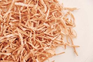 Wood shavings on white background. Top view. Copy, empty space for text photo
