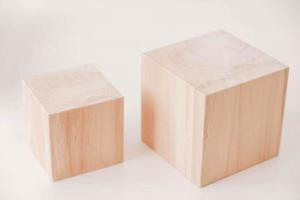 Two wooden blocks from natural wood on a white background. Copy, empty space for text photo