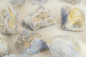 Blue chalcedony on a white background. Copy, empty space for text photo
