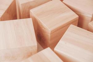 Wooden cubes from natural wood on a white background. Copy, empty space for text photo