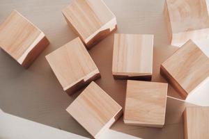 Wooden cubes from natural wood on a white background. Copy, empty space for text photo